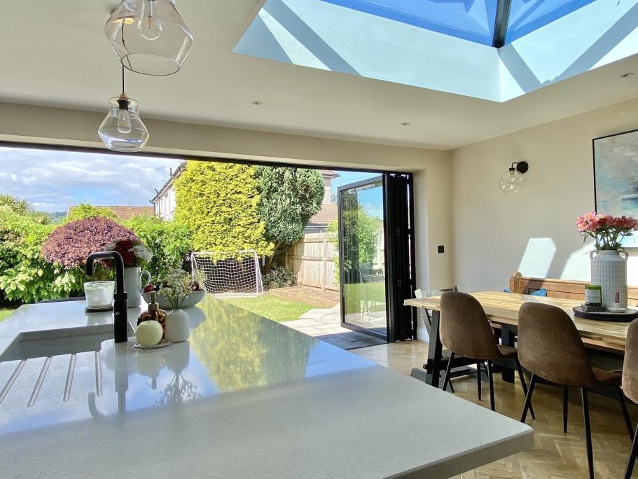 Bright kitchen extension featuring skylights and contemporary finishes